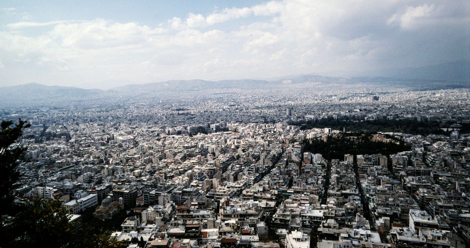Unforgettable Fly Over Athens City & Riviera by Helicopter Review: The Ultimate Aerial Experience in Greece Review 2026 - Breathtaking aerial view of Athens, Greece, showcasing urban sprawl under a cloudy sky.