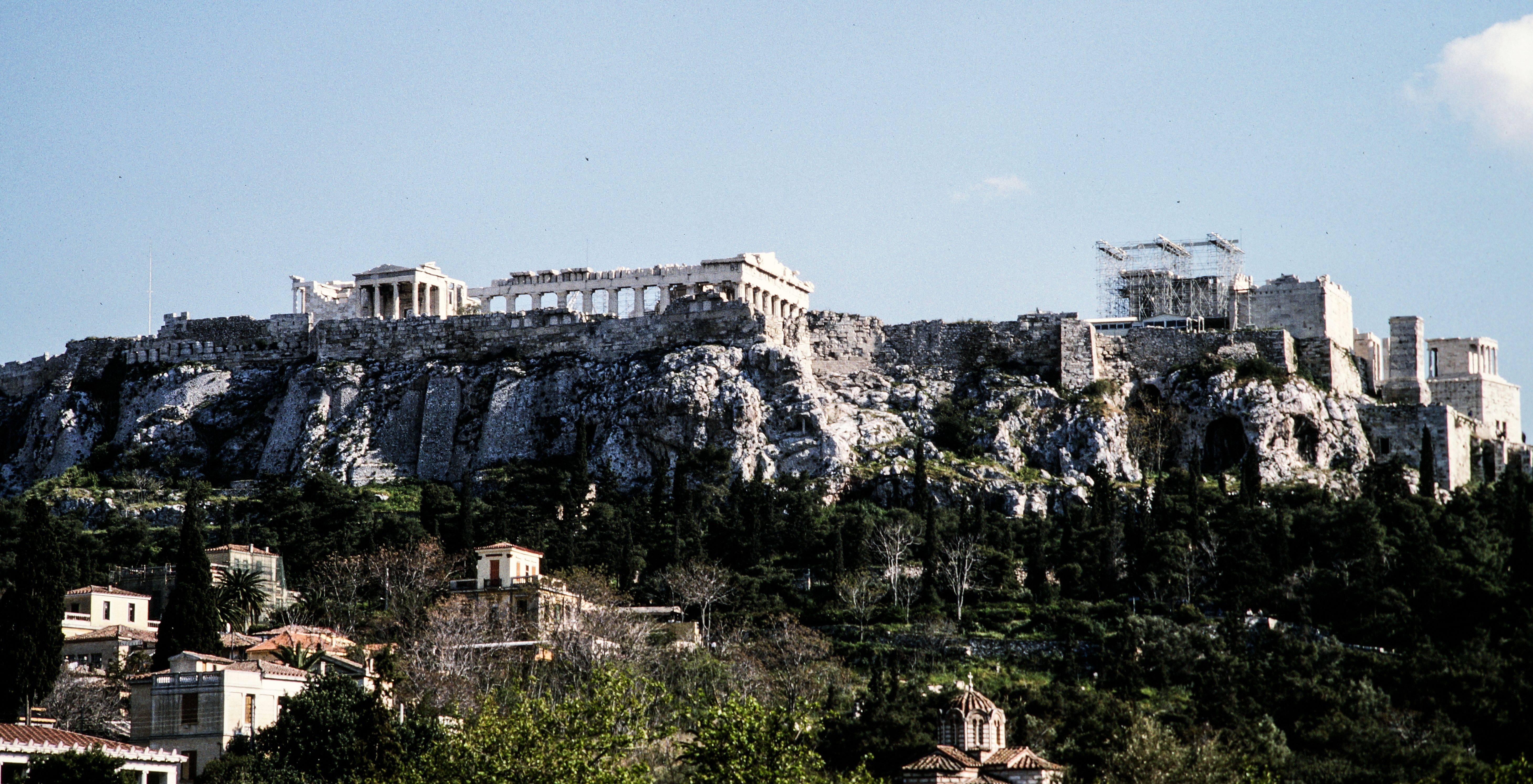 The iconic Acropolis of Athens, Greece under a clear blue sky.