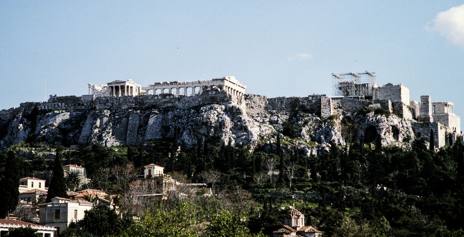 The iconic Acropolis of Athens, Greece under a clear blue sky.