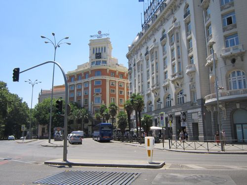 Free Sunlit street scene with iconic architecture in central Madrid, Spain. Stock Photo