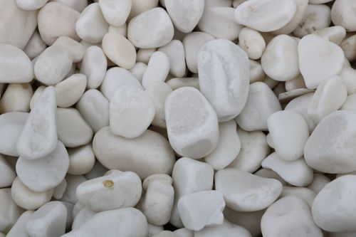 Free High-quality image of smooth white gravel stones, ideal for backgrounds or design elements. Stock Photo
