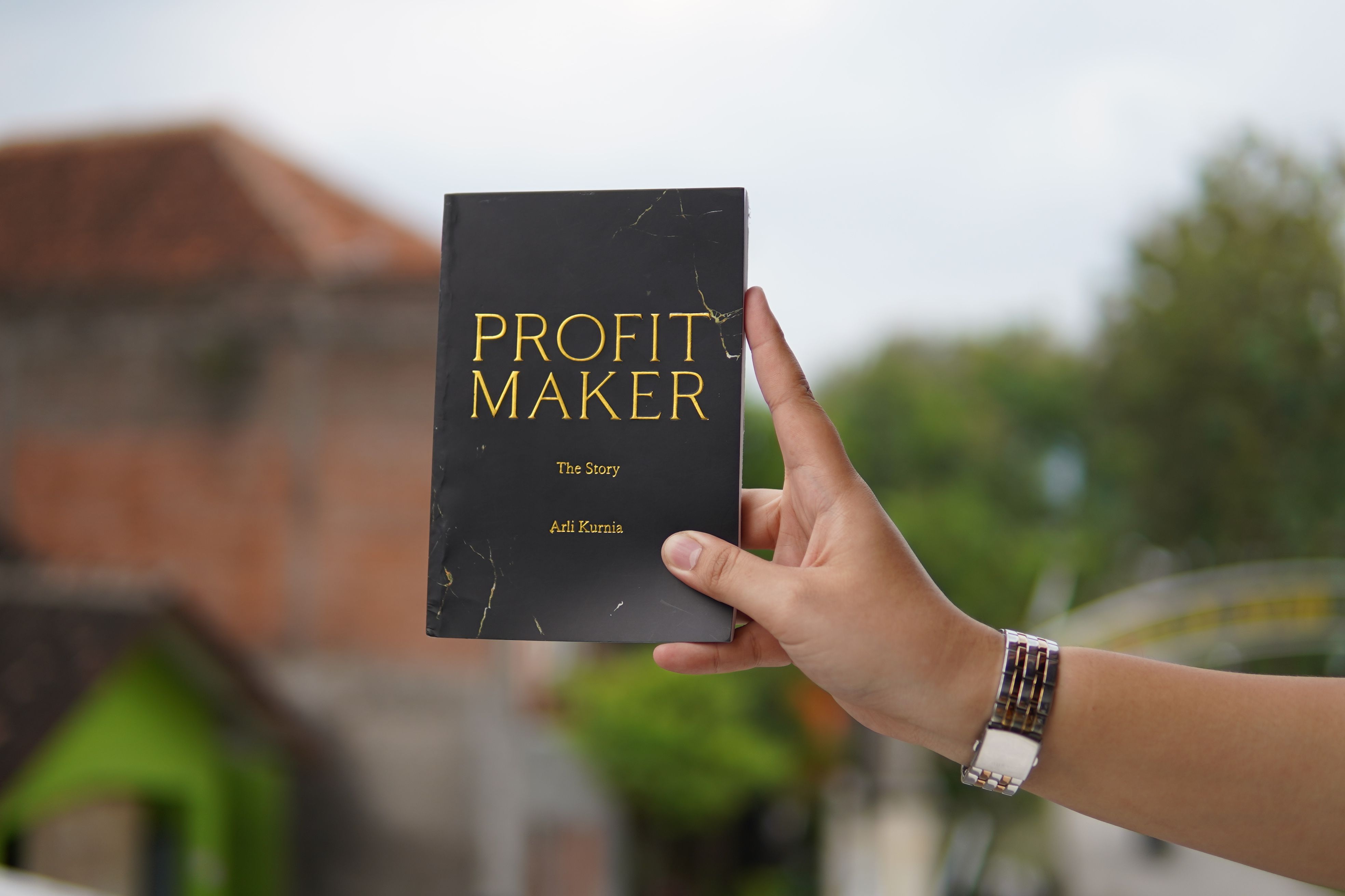 A hand holding the book 