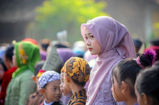 Woman in traditional attire at a cultural event, showcasing rich cultural heritage.