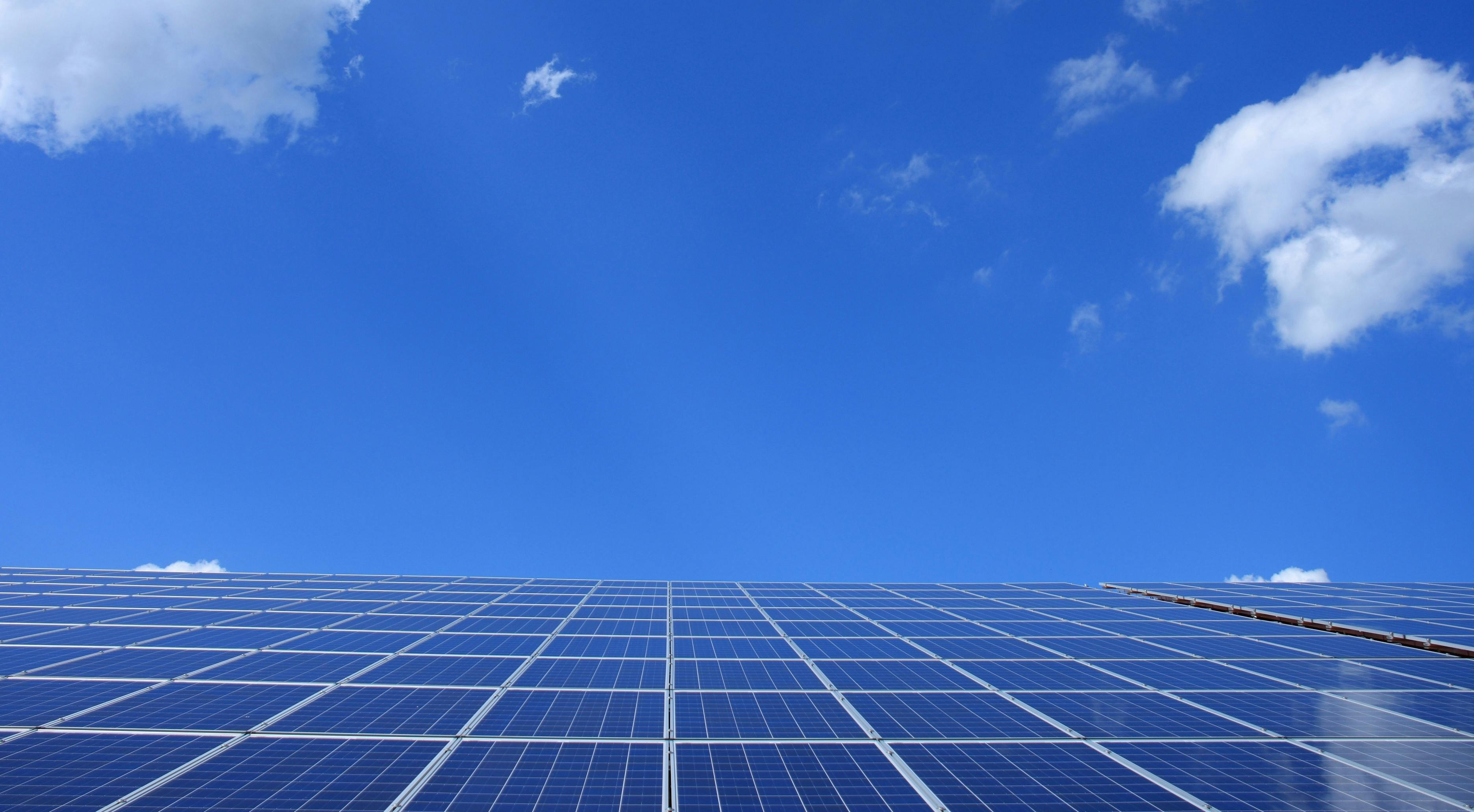 Blue Solar Panels Under Sunny Sky · Free Stock Photo