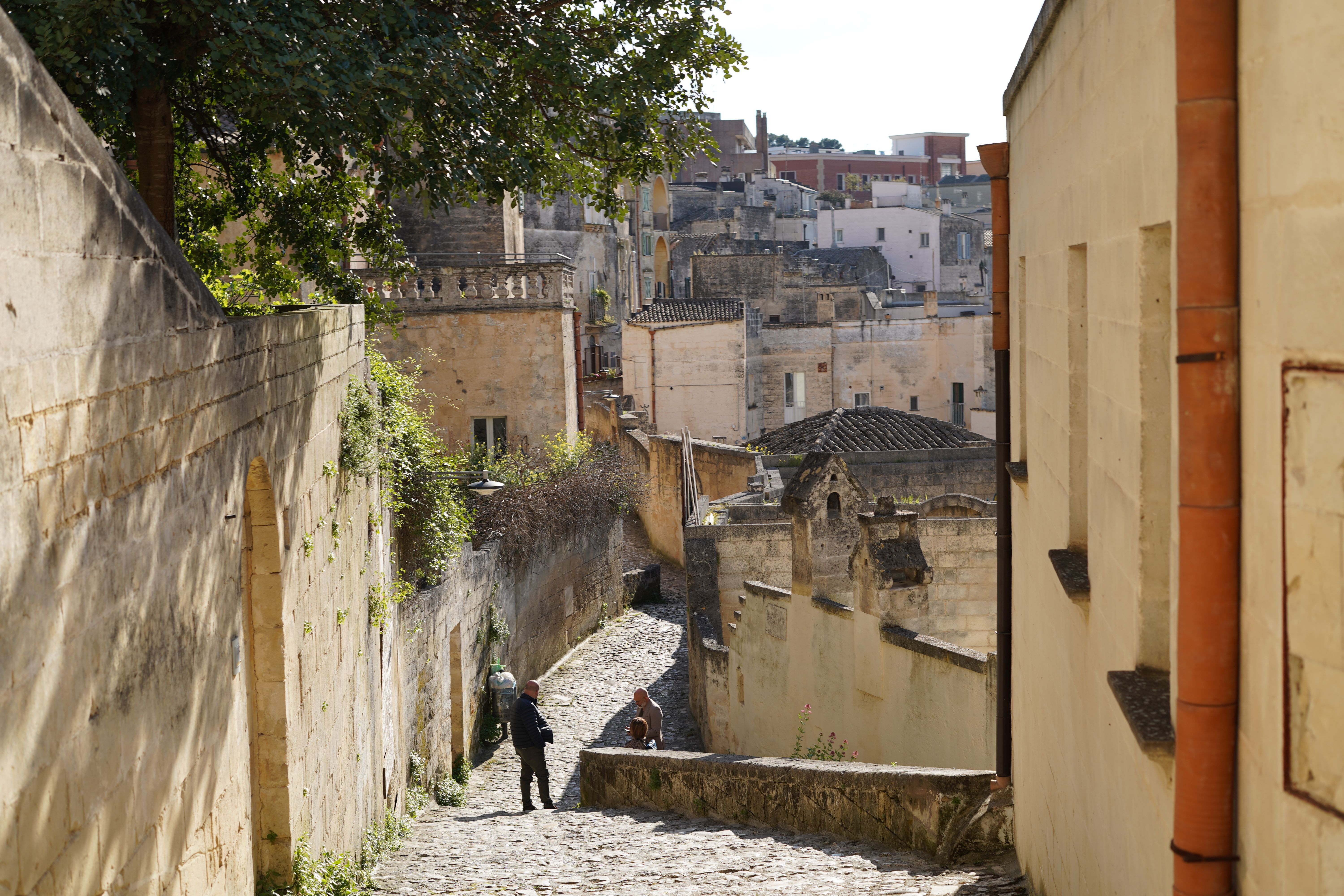 Explore the ancient streets of Matera, Italy, featuring historic architecture and serene pathways.