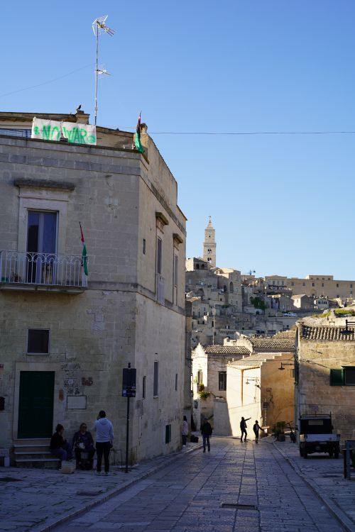 Free Explore the ancient streets of Matera, Basilicata with its iconic stone architecture under a clear sky. Stock Photo
