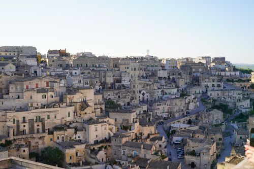 Free A serene view of the ancient stone cityscape of Matera, showcasing historic architecture under the clear sky. Stock Photo