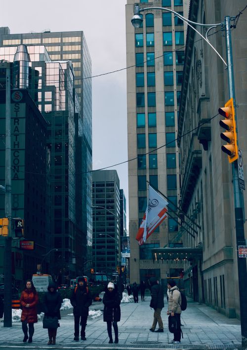 Free City street scene in winter with pedestrians and skyscrapers in downtown Toronto, Canada. Stock Photo