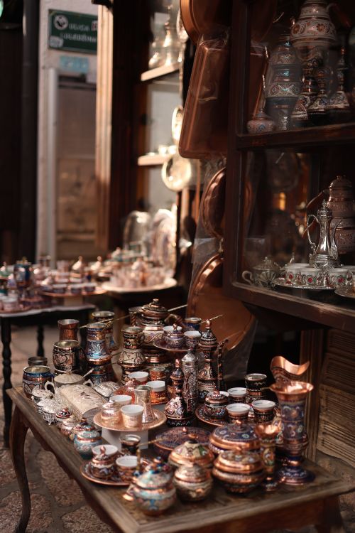 Free Traditional copperware shop showcasing ornate pots and jugs in a market setting. Stock Photo