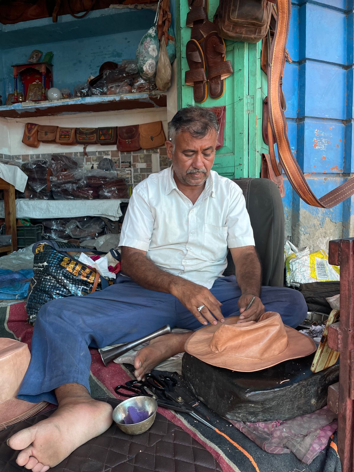 Indian leather craftsman at work, representative of the leather manufacturing trade Kanpur is known for