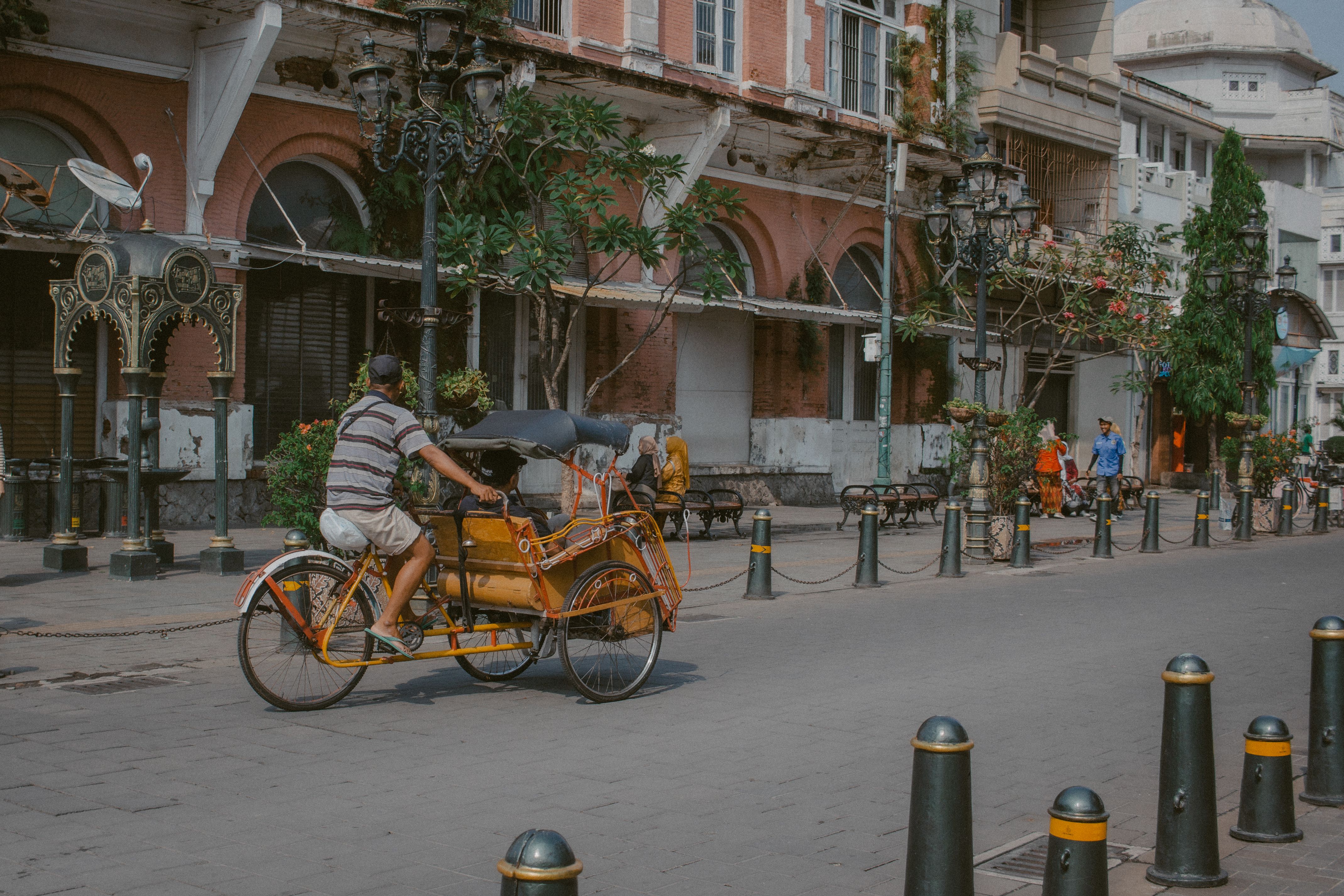 Street Scene with Rickshaw in Historic Urban Setting · Free Stock Photo