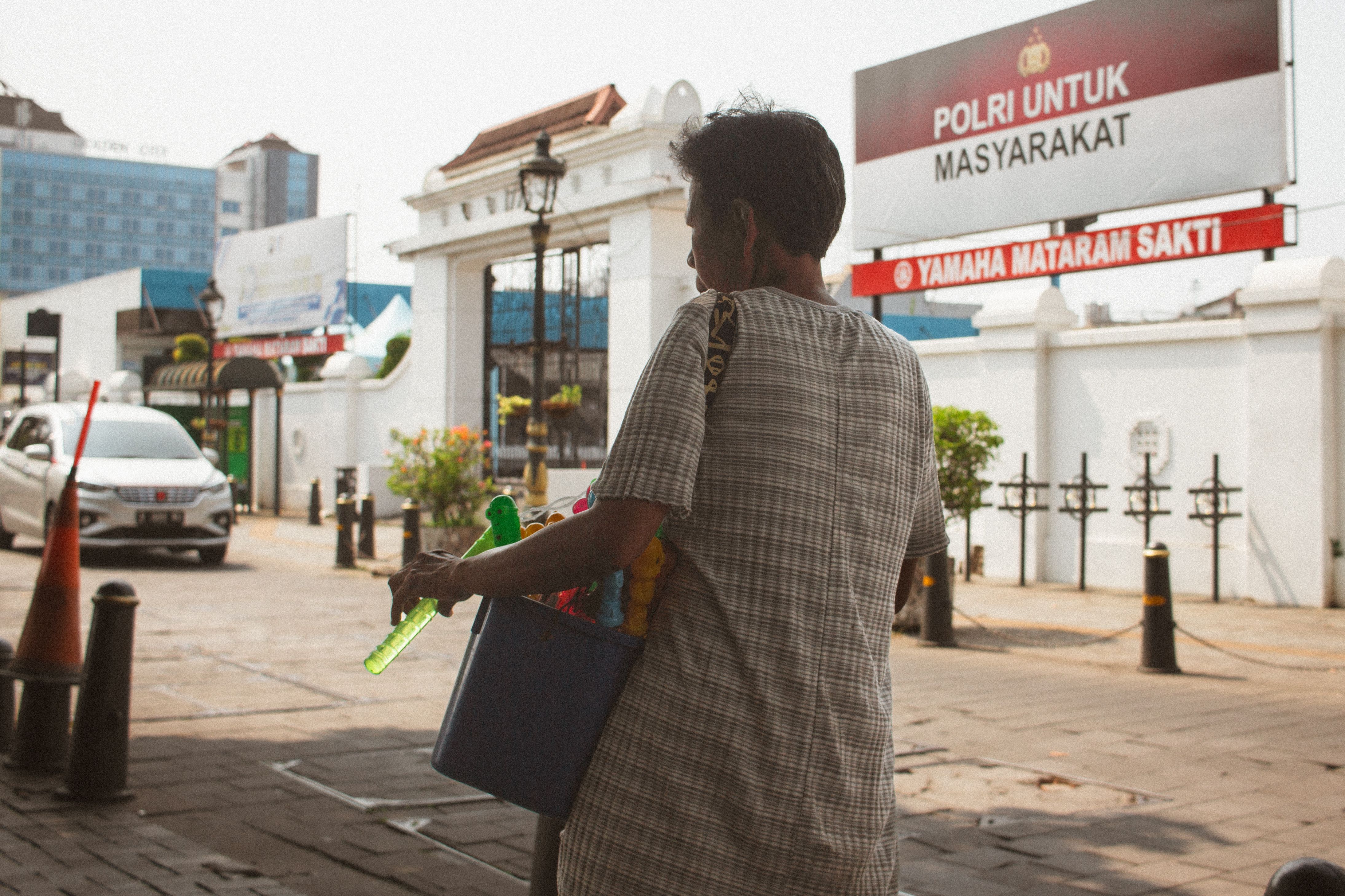 Back view of street vendor in urban setting