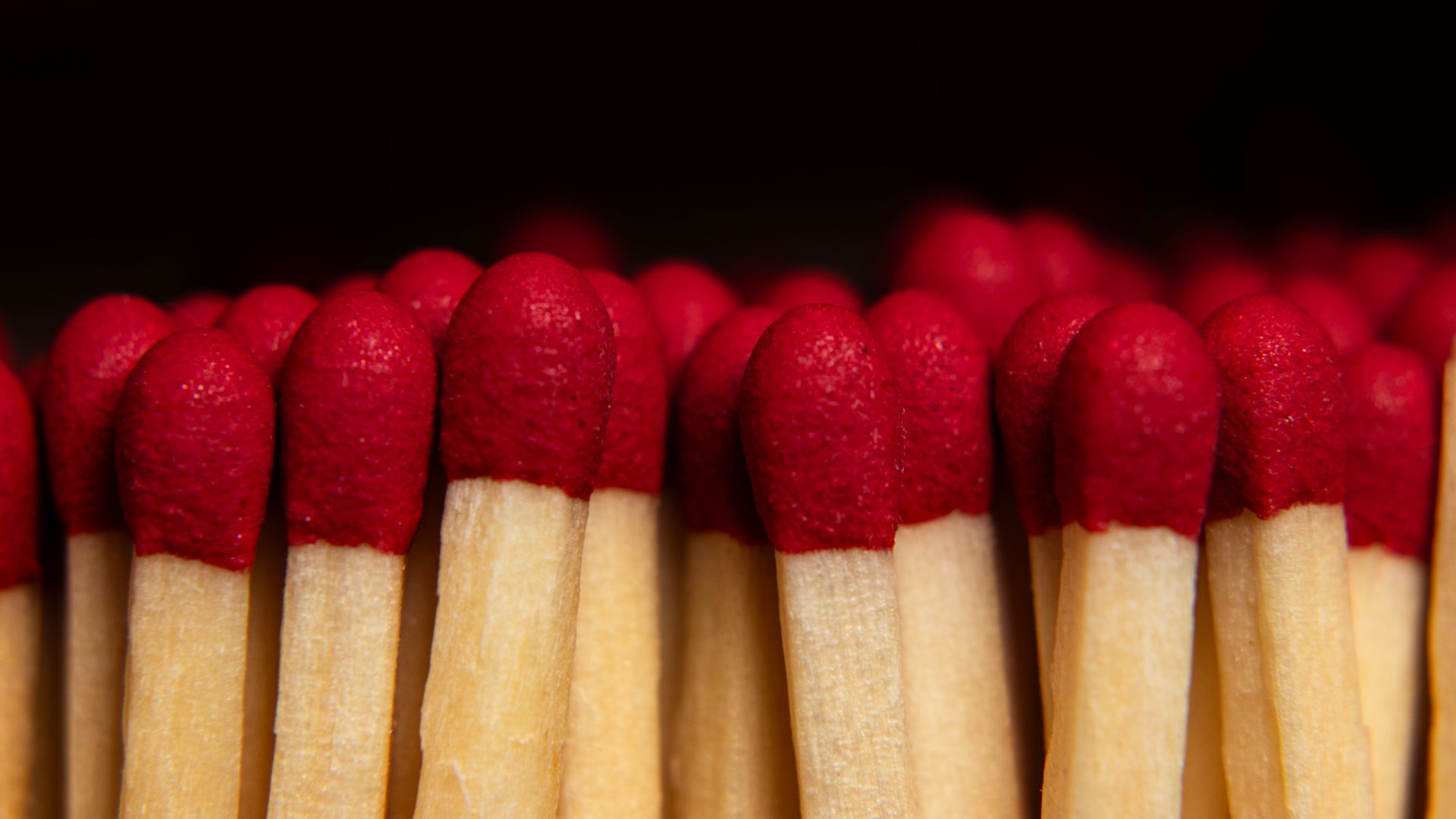Maximising Benefits Tips: Enhance Your Modafinil Experience Macro shot of red-tipped wooden matchsticks aligned vertically in a symmetrical pattern — maximising benefits tips