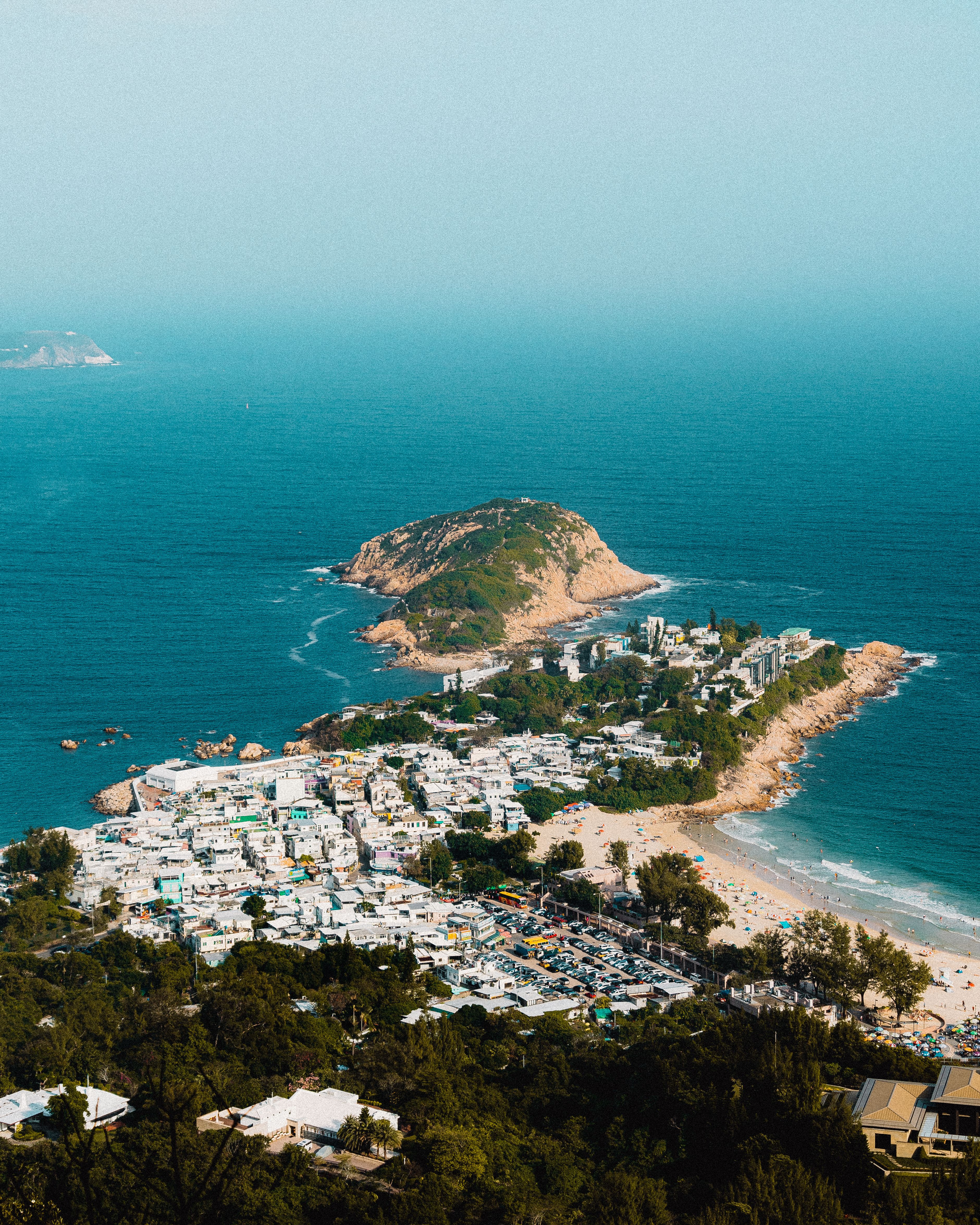 Stunning aerial view of Shek O Peninsula and Beach showcasing coastal beauty and urban blend.