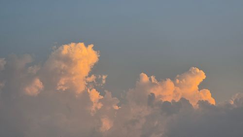 Free A calm evening sky with golden clouds in Gia Lai, Vietnam captured during sunset. Stock Photo