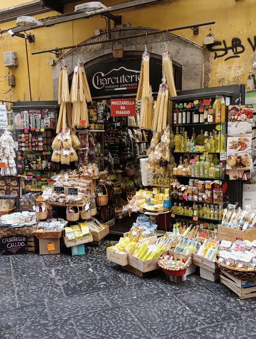 Free Colorful display of pasta and local goods at a Napoli artisan shop entrance. Stock Photo