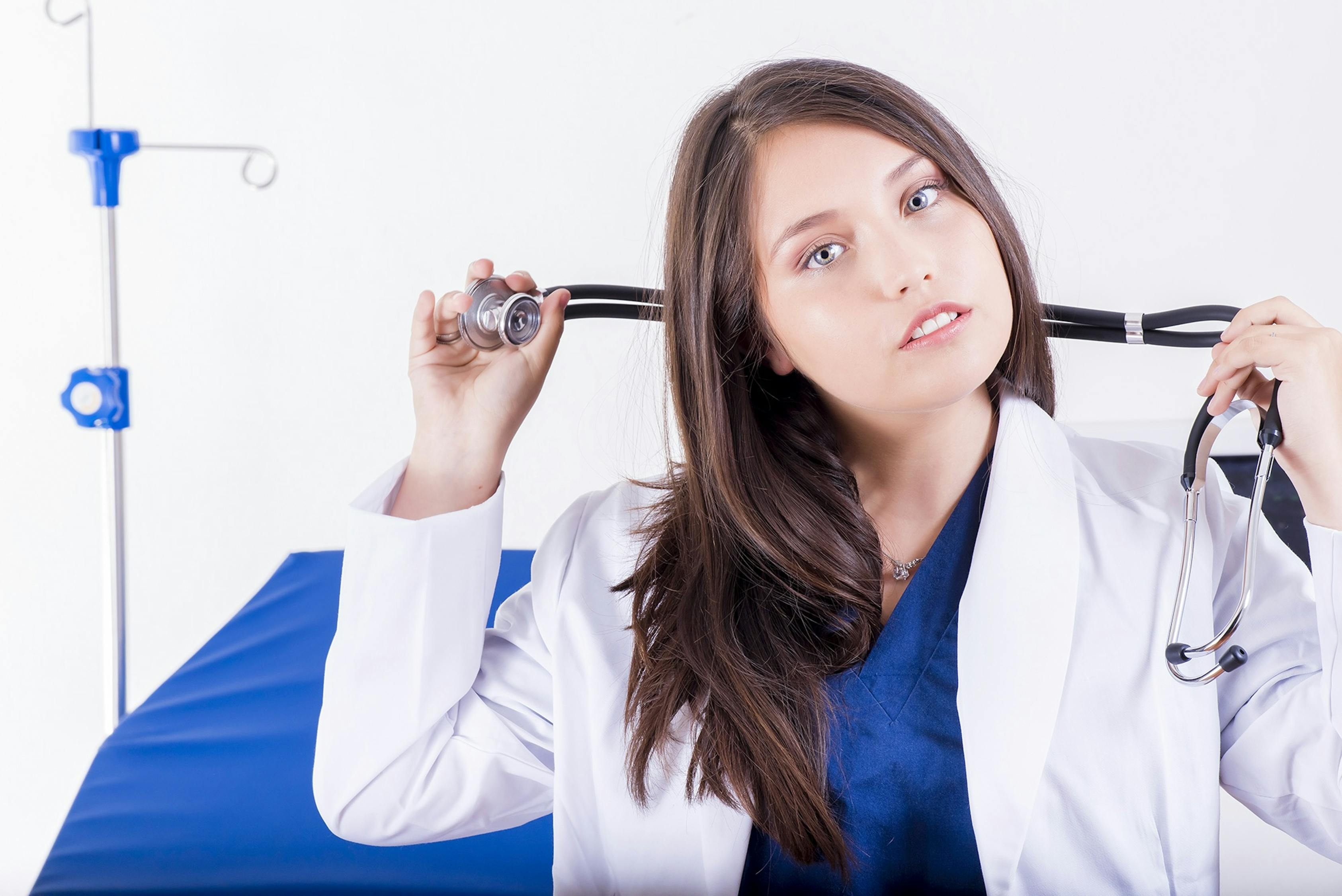Woman Holding Black Stethoscope