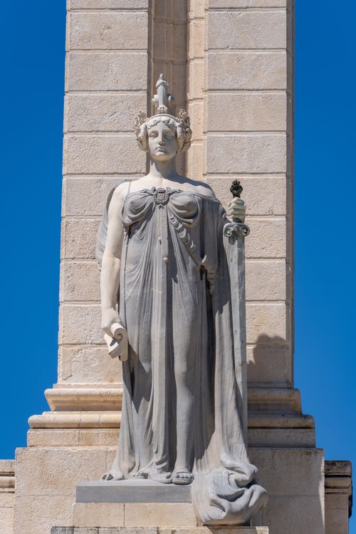 Free Statue of Roman goddess in Cádiz, Andalucía against a clear blue sky. Stock Photo