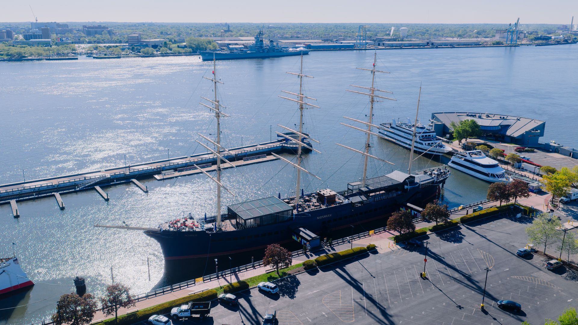 Aerial view of Penn's Landing on the Delaware River, with the Moshulu tall ship moored at the pier