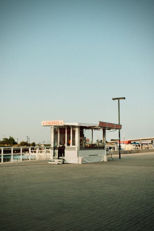 Free A charming churro kiosk on the riverside promenade in Tavira, Portugal. Stock Photo