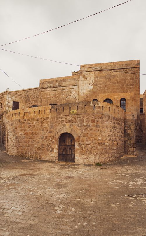 Free Explore the ancient stone architecture of Mardin, Türkiye, featuring traditional design and historical ambiance. Stock Photo