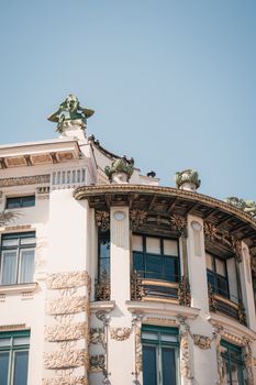 Elegant Art Nouveau building facade in Vienna, showcasing ornate architectural details against a clear sky.. pexels, elegant,
