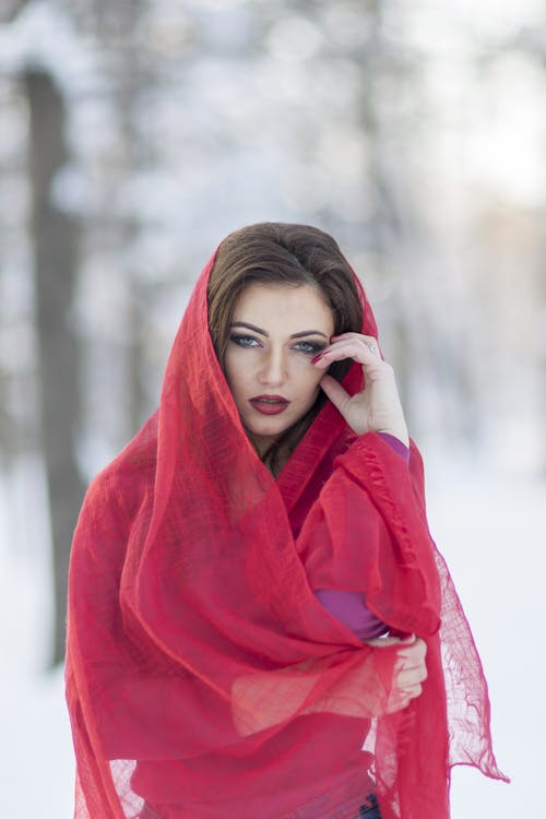 Free Woman Touching Forehead With Left Hand and Wearing Headdress Stock Photo