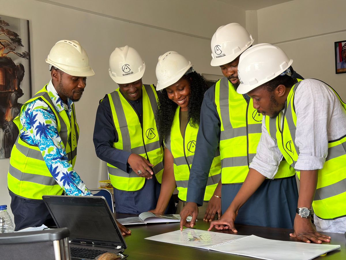 Diverse team collaborating on construction project plans