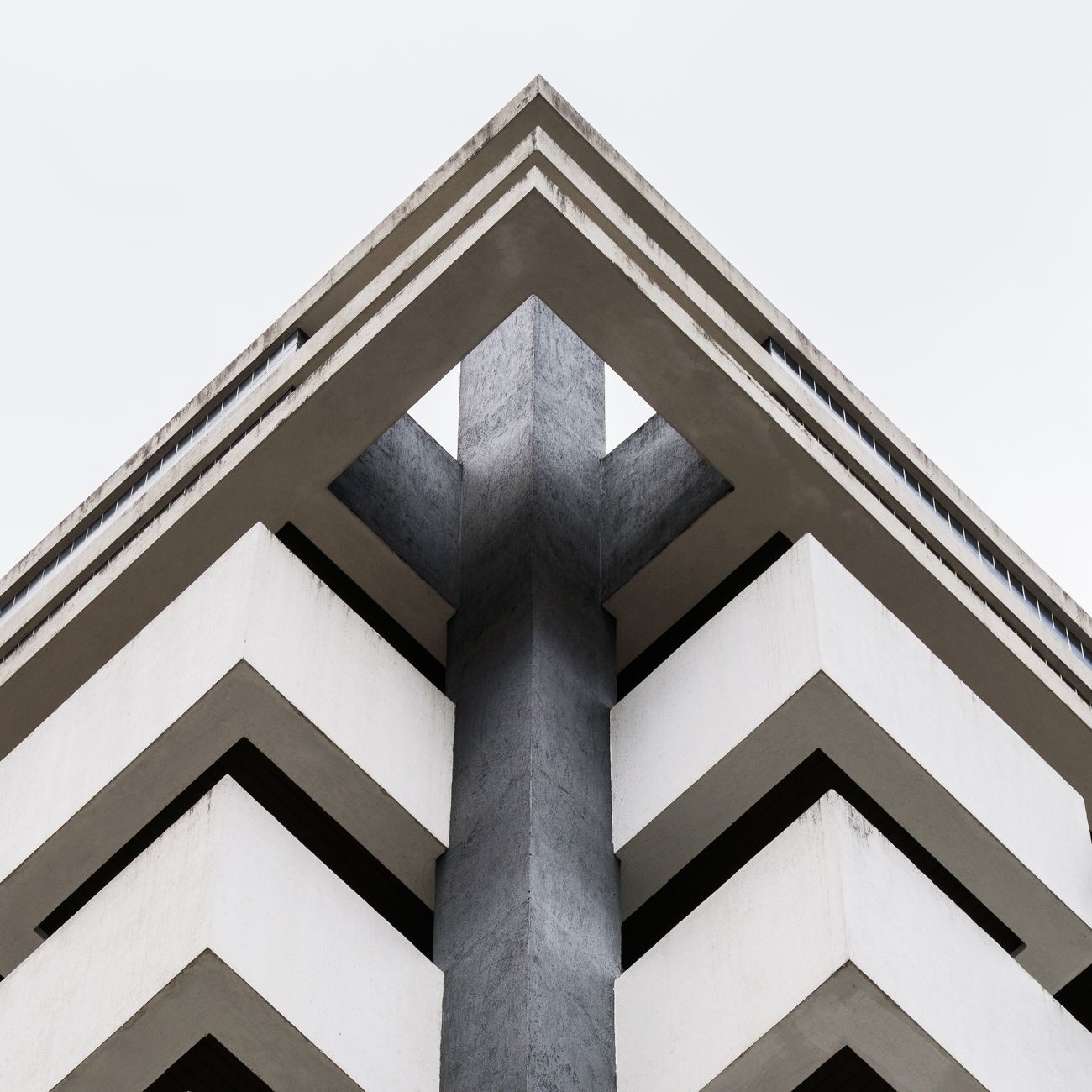 Abstract view of modern building architecture with geometric symmetry and minimalist design elements.