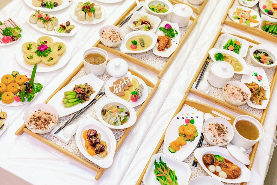 Beautifully arranged Asian dishes featuring a variety of gourmet delicacies and traditional culinary craftsmanship.