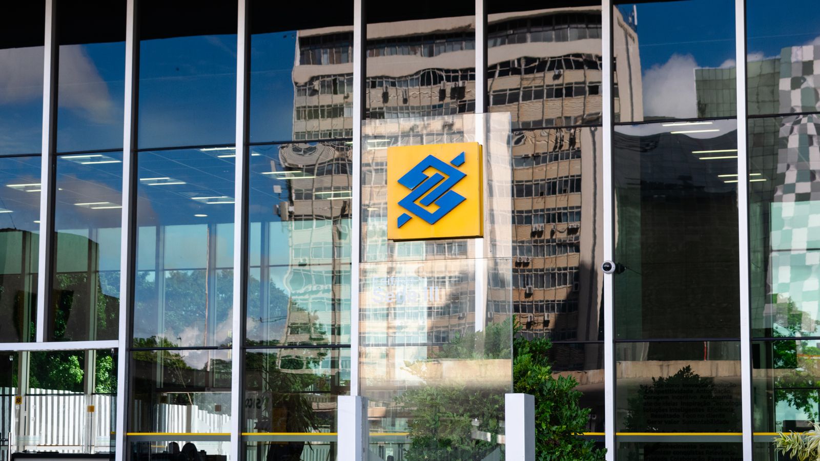 Modern building exterior in Brasília, Brazil, featuring reflective glass and iconic Banco logo.