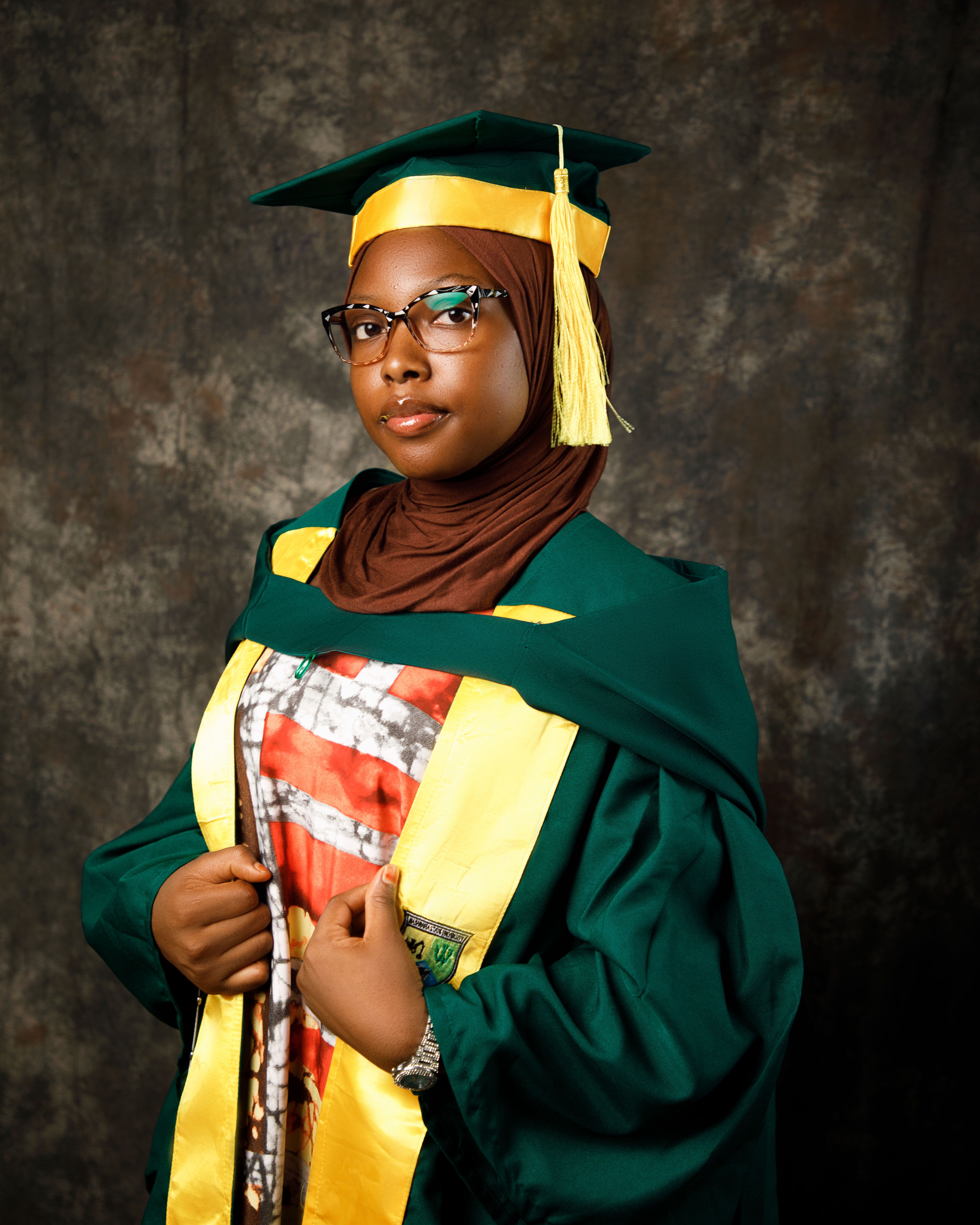 Young Graduate in Hijab with Cap and Gown Free Stock Photo Young Graduate in Hijab with Cap and Gown Free Stock Photo