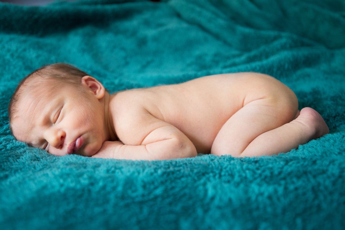 A newborn baby sleeping peacefully