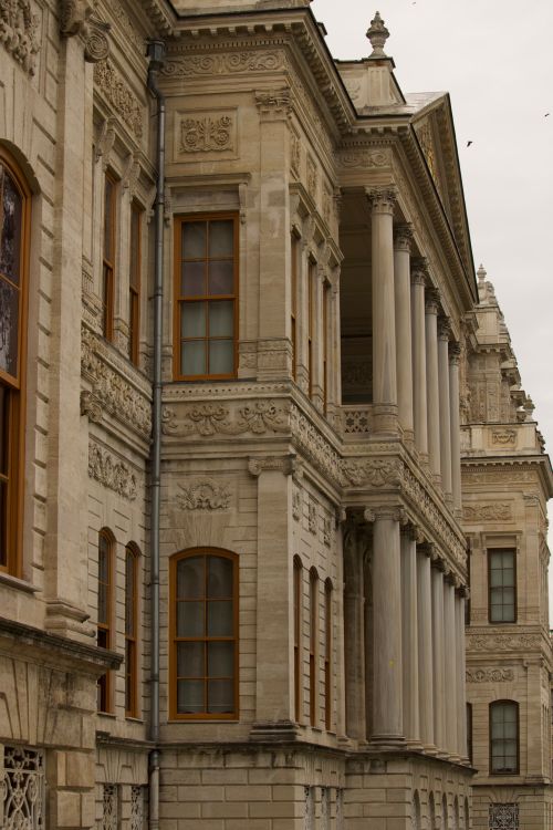 Free Detailed view of a historic architectural facade with columns and decorative elements. Stock Photo