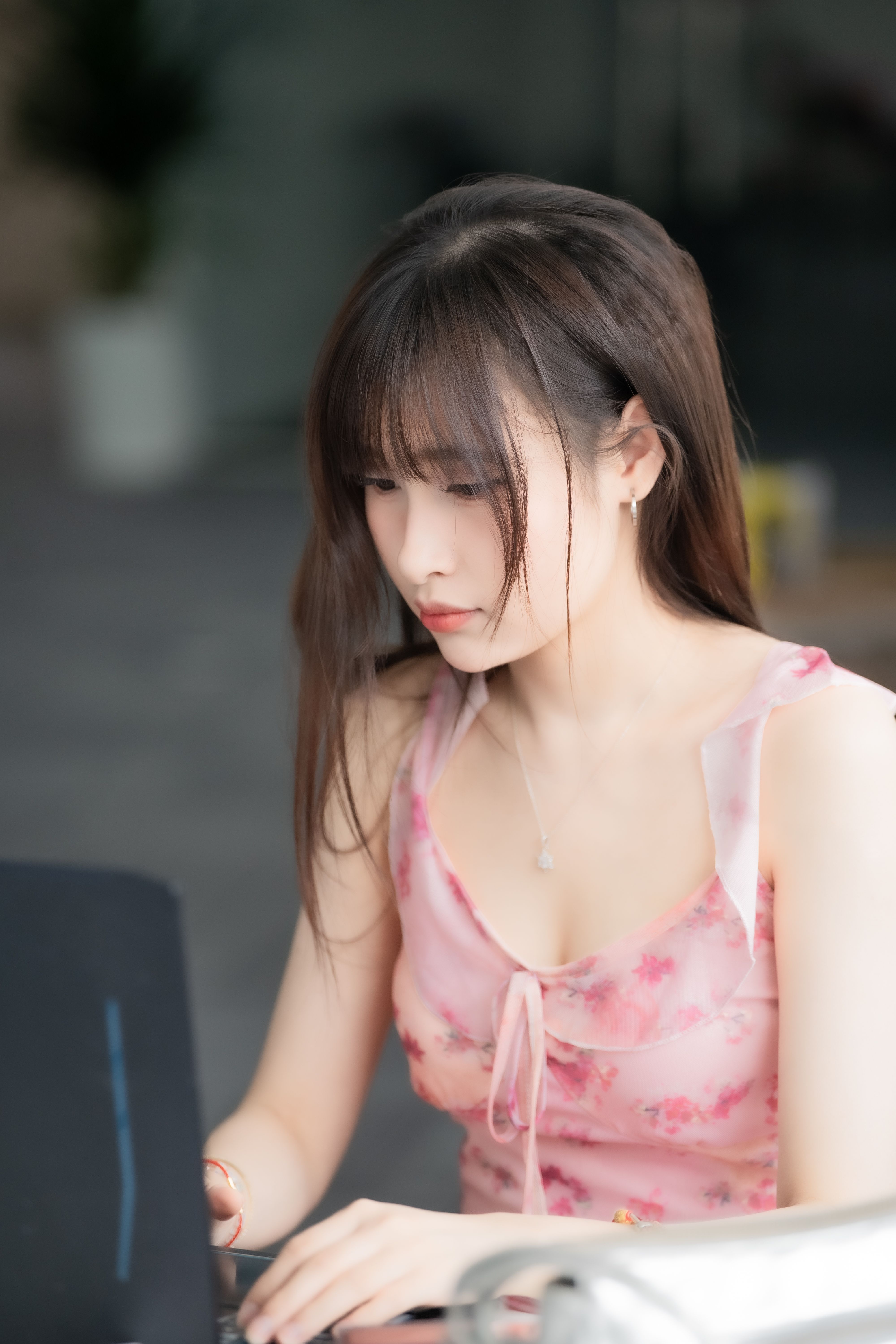 Young Woman Focused on Laptop Work Indoors