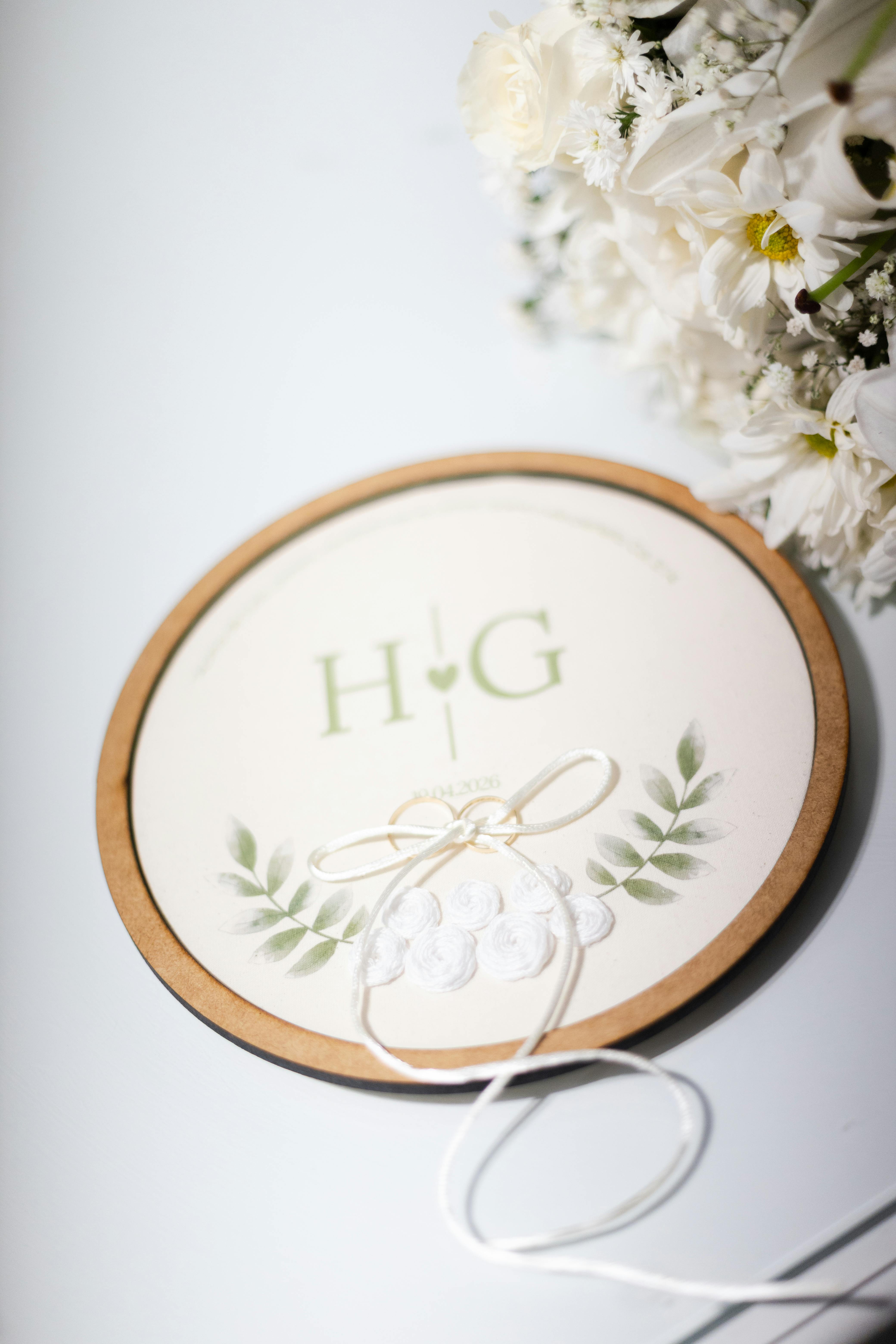Stylish wedding invitation featuring floral elements and initials, perfect for romantic ceremonies.