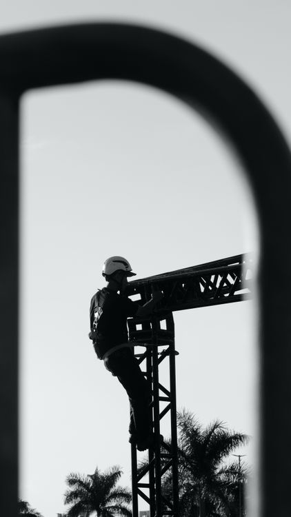 Black and White Construction Worker on Scaffolding · Free Stock Photo