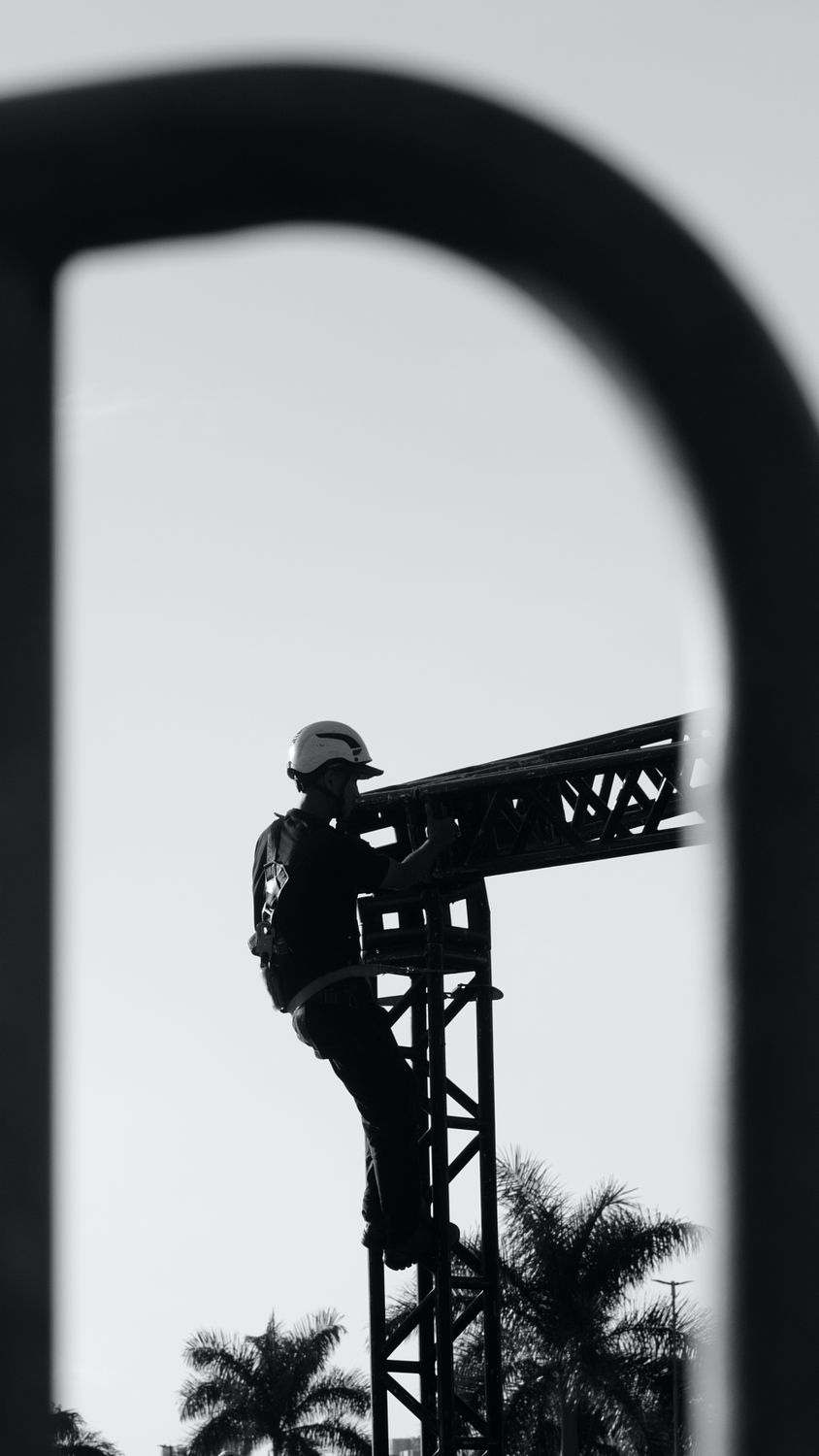 Black and White Construction Worker on Scaffolding · Free Stock Photo