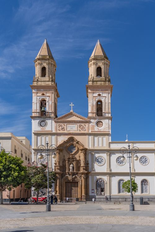 Free Stunning view of the Cathedral Church of San Juan de Dios in Cádiz's sunny plaza. Stock Photo