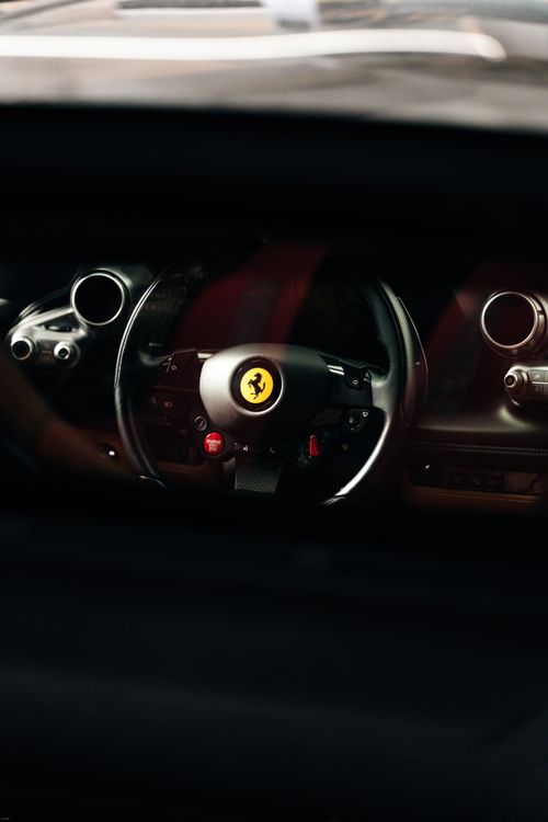 Free Close-up of a luxury sports car steering wheel showcasing premium design and technology. Stock Photo