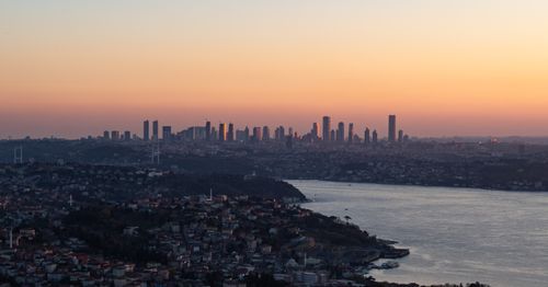 Free Breathtaking sunset view of Istanbul skyline over the Bosphorus, showcasing cityscape silhouettes and vibrant skies. Stock Photo