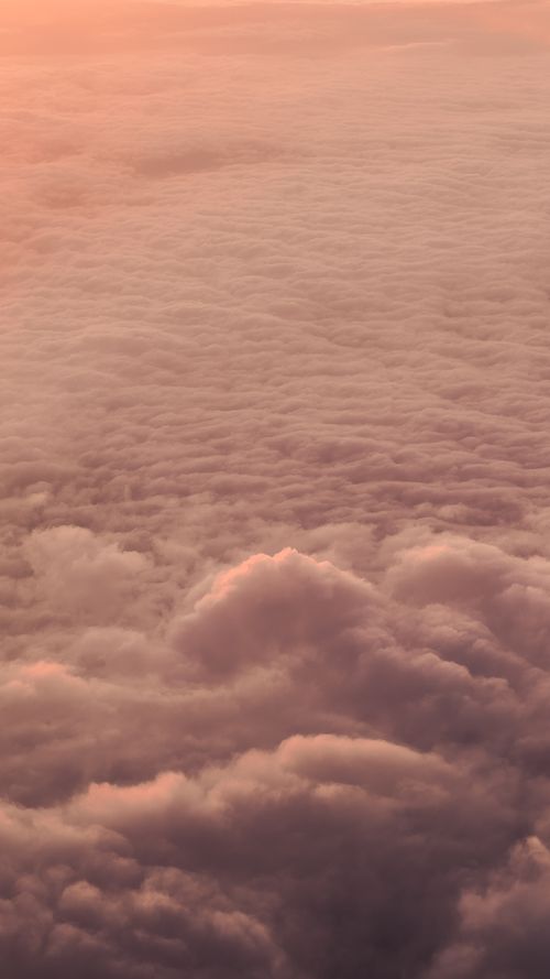 Free Beautiful aerial view of clouds during sunset, showcasing a serene and dreamy atmosphere. Stock Photo