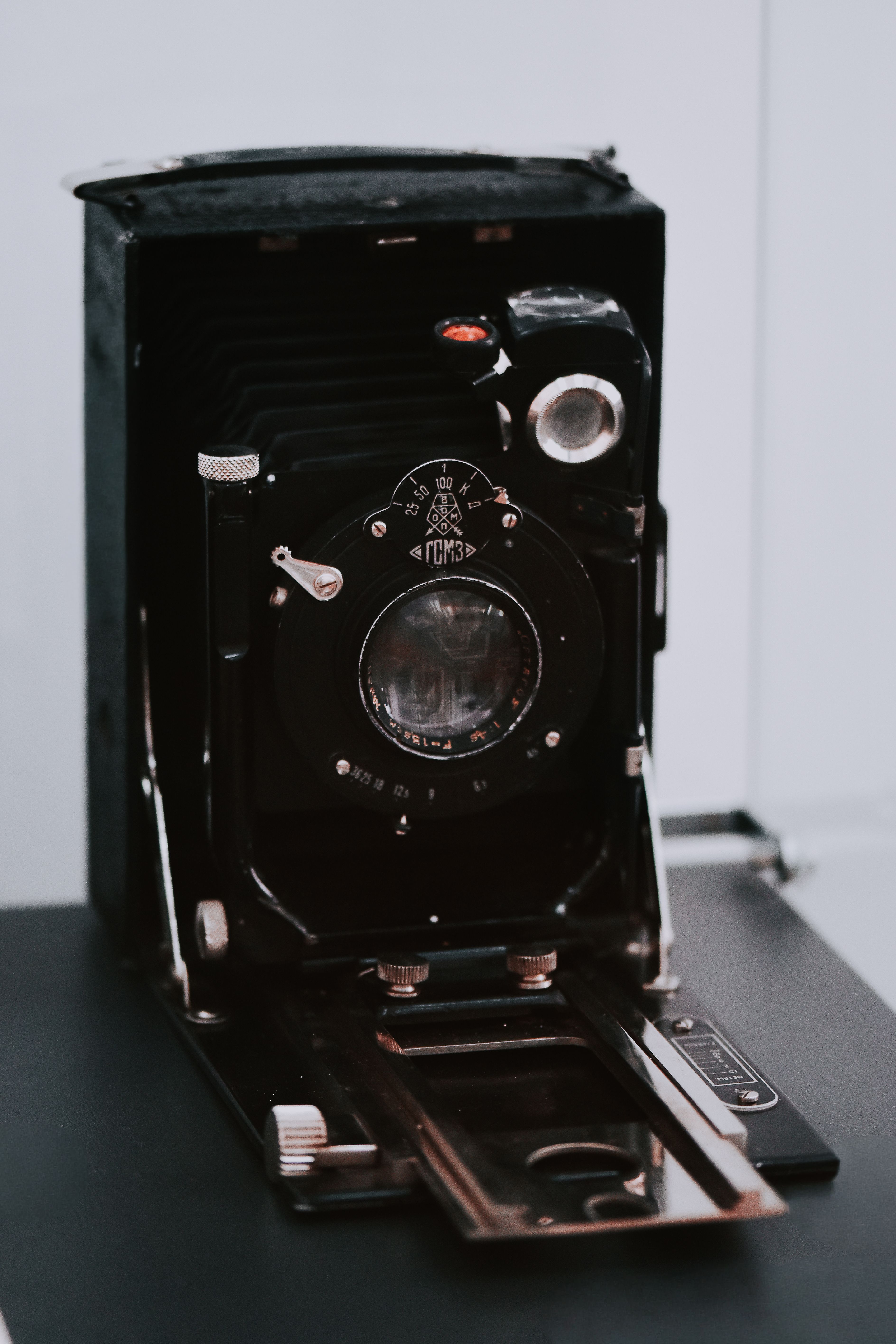 Close-up of a classic foldable film camera, ideal for retro photography enthusiasts.