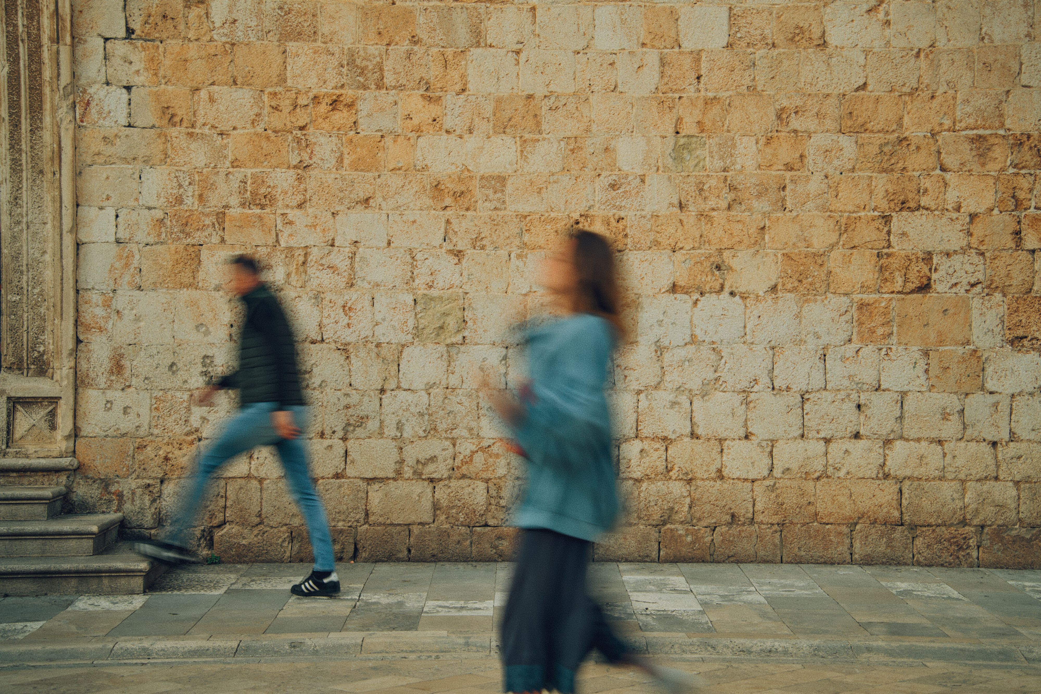 Comfortable walking shoes on ancient cobblestone streets in Dubrovnik, Croatia.