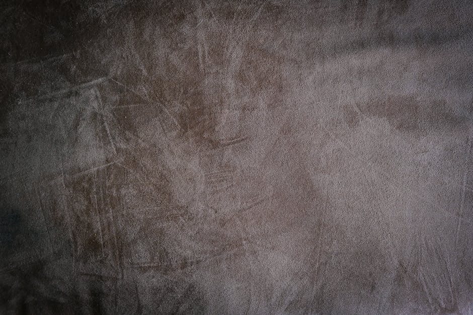 Próbki tkanin w odcieniach grafitu, rdzy i beżu ułatwiają dobór obicia w stylu loft