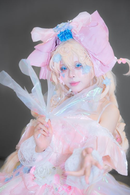 Free A captivating pastel-themed cosplay of a woman in a detailed pink costume. Stock Photo