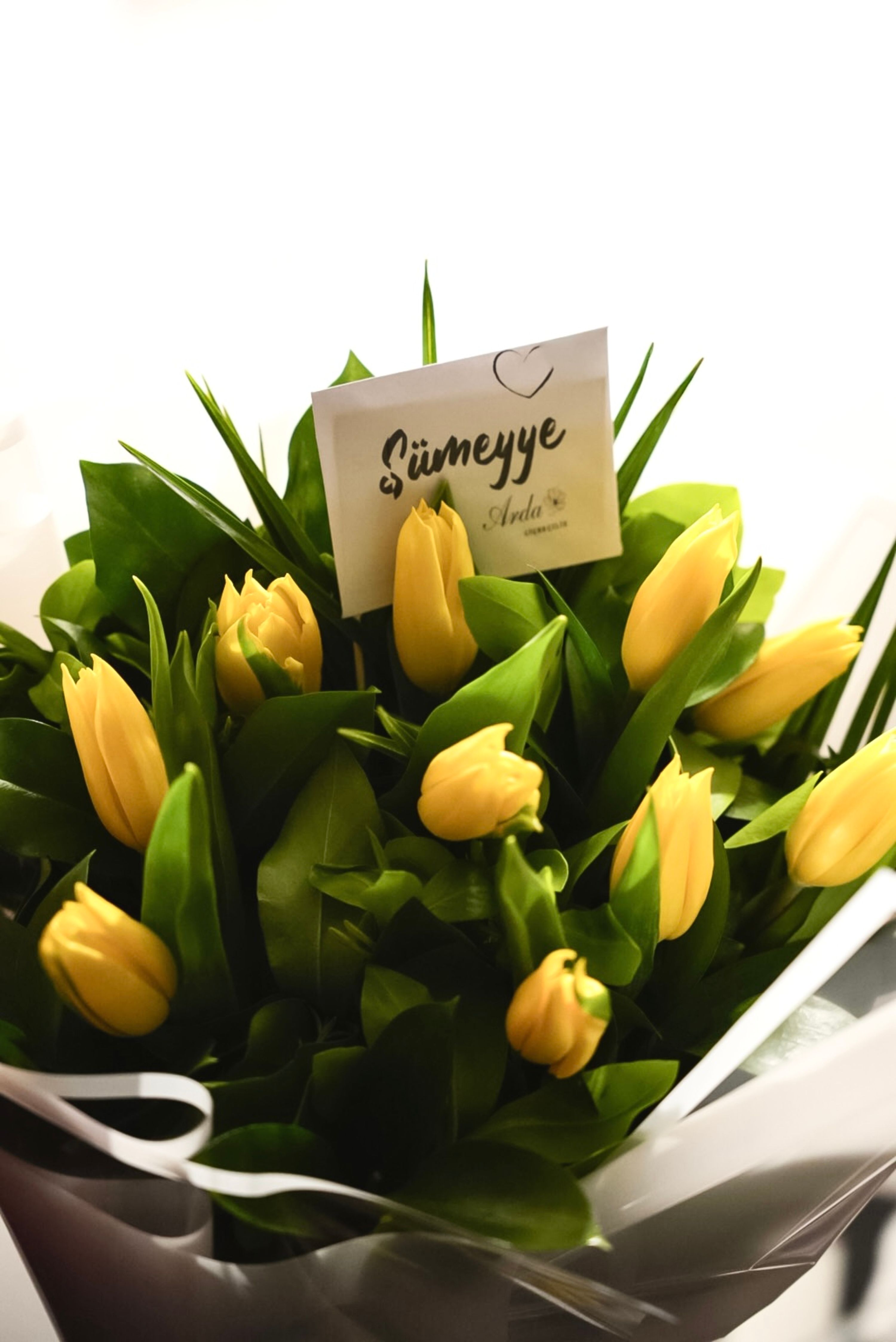 Beautiful bouquet of yellow tulips with a personalized card, perfect for special occasions like birthdays or anniversaries.