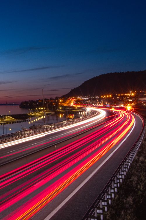 Free Long exposure capturing dynamic night traffic light trails in Jönköping, Sweden. Stock Photo
