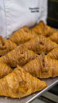 Golden brown croissants fresh from the oven at a bakery in Istanbul, Turkiye.