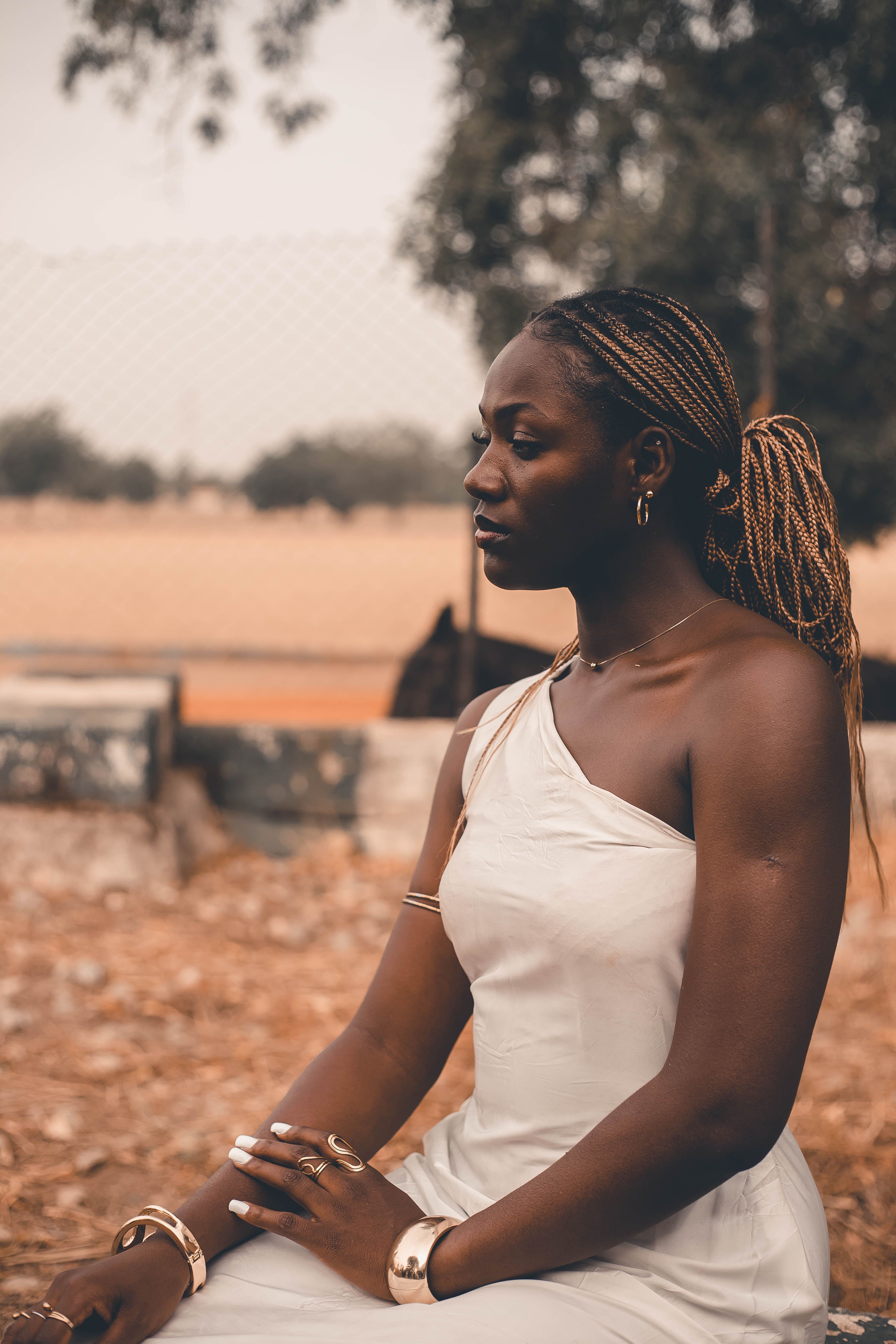 Elegant Woman Posing Outdoors in Natural Setting · Free Stock Photo